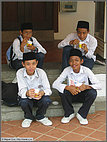 Snacking Malay schoolboys